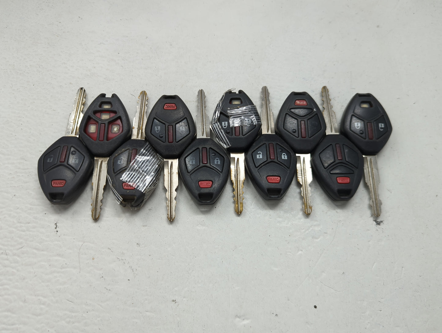 Lot of 10 Mitsubishi Keyless Entry Remote Fob MIXED FCC IDS 1474204 - Oemusedautoparts1.com