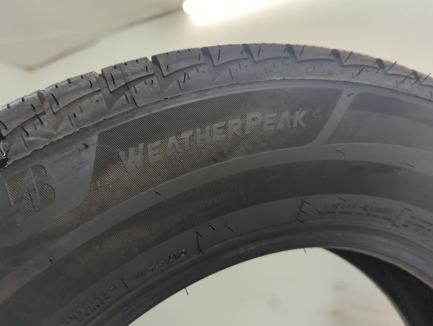 Used Tire 225/65R17 BRIDGESTONE WEATHERPEAK 102H - Tread Depth 10/32 - Oemusedautoparts1.com