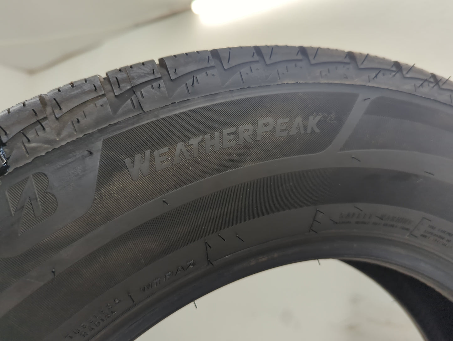 Used Tire 225/65R17 BRIDGESTONE WEATHERPEAK 102H - Tread Depth 10/32 - Oemusedautoparts1.com