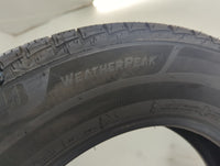 Used Tire 225/65R17 BRIDGESTONE WEATHERPEAK 102H - Tread Depth 10/32 - Oemusedautoparts1.com
