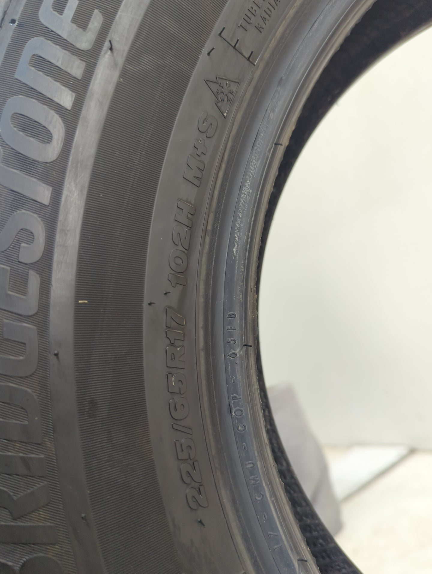 Used Tire 225/65R17 BRIDGESTONE WEATHERPEAK 102H - Tread Depth 10/32 - Oemusedautoparts1.com