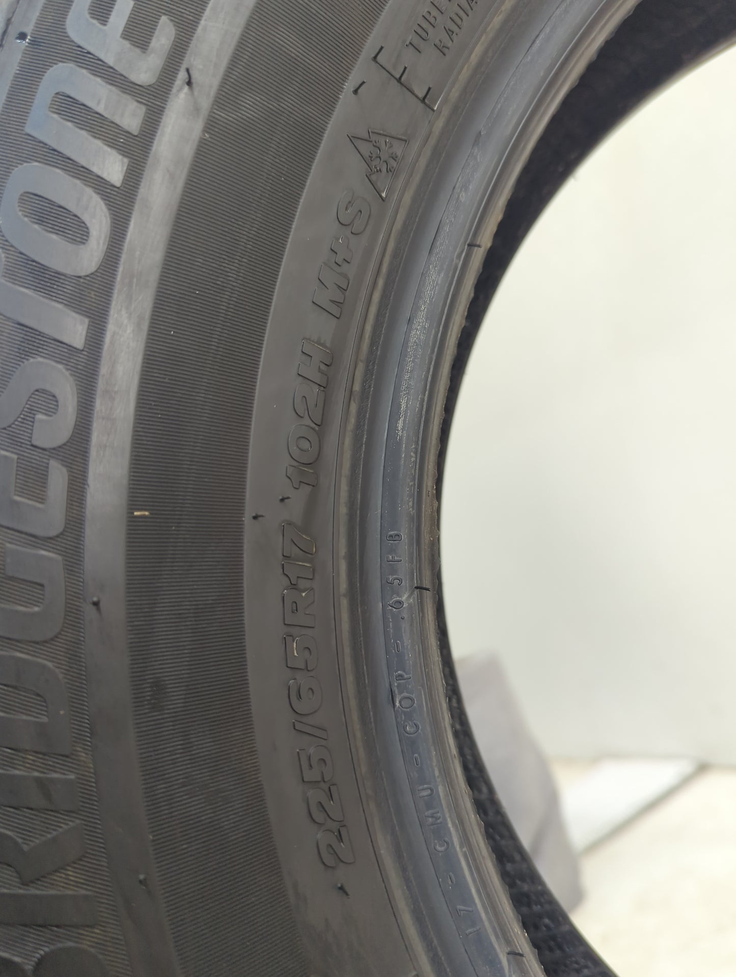 Used Tire 225/65R17 BRIDGESTONE WEATHERPEAK 102H - Tread Depth 10/32 - Oemusedautoparts1.com