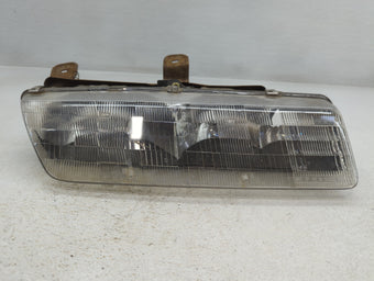 compare product 1993 Pontiac Grand Am Passenger Right Oem Head Light Headlight Lamp