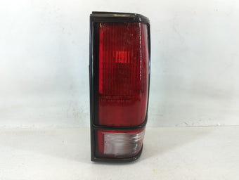 compare product 1994 Gmc S15 Tail Light Assembly Passenger Right OEM P/N:5973320 5973319, SAE AIRST 3 85 DOT TAIWAN, TYC 11-I324-IB Fits OEM Used Auto Parts