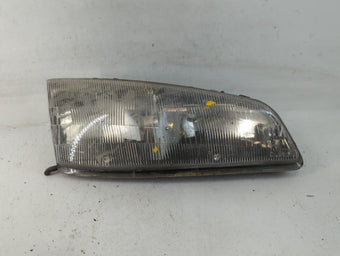 compare product 1992-1995 Pontiac Grand Am Passenger Right Oem Head Light Headlight Lamp