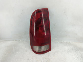 compare product 1997-1999 Ford F-150 Tail Light Assembly Driver Left OEM P/N:F75B-13B505 Fits Fits 1997 1998 1999 OEM Used Auto Parts