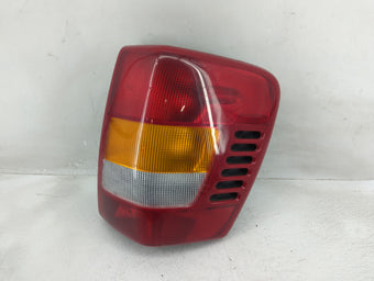 compare product 1999-2002 Jeep Grand Cherokee Tail Light Assembly Passenger Right OEM P/N:PIA-10680 Fits Fits 1999 2000 2001 2002 OEM Used Auto Parts