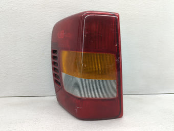 compare product 1999-2002 Jeep Grand Cherokee Tail Light Assembly Driver Left OEM P/N:55155138 Fits Fits 1999 2000 2001 2002 OEM Used Auto Parts