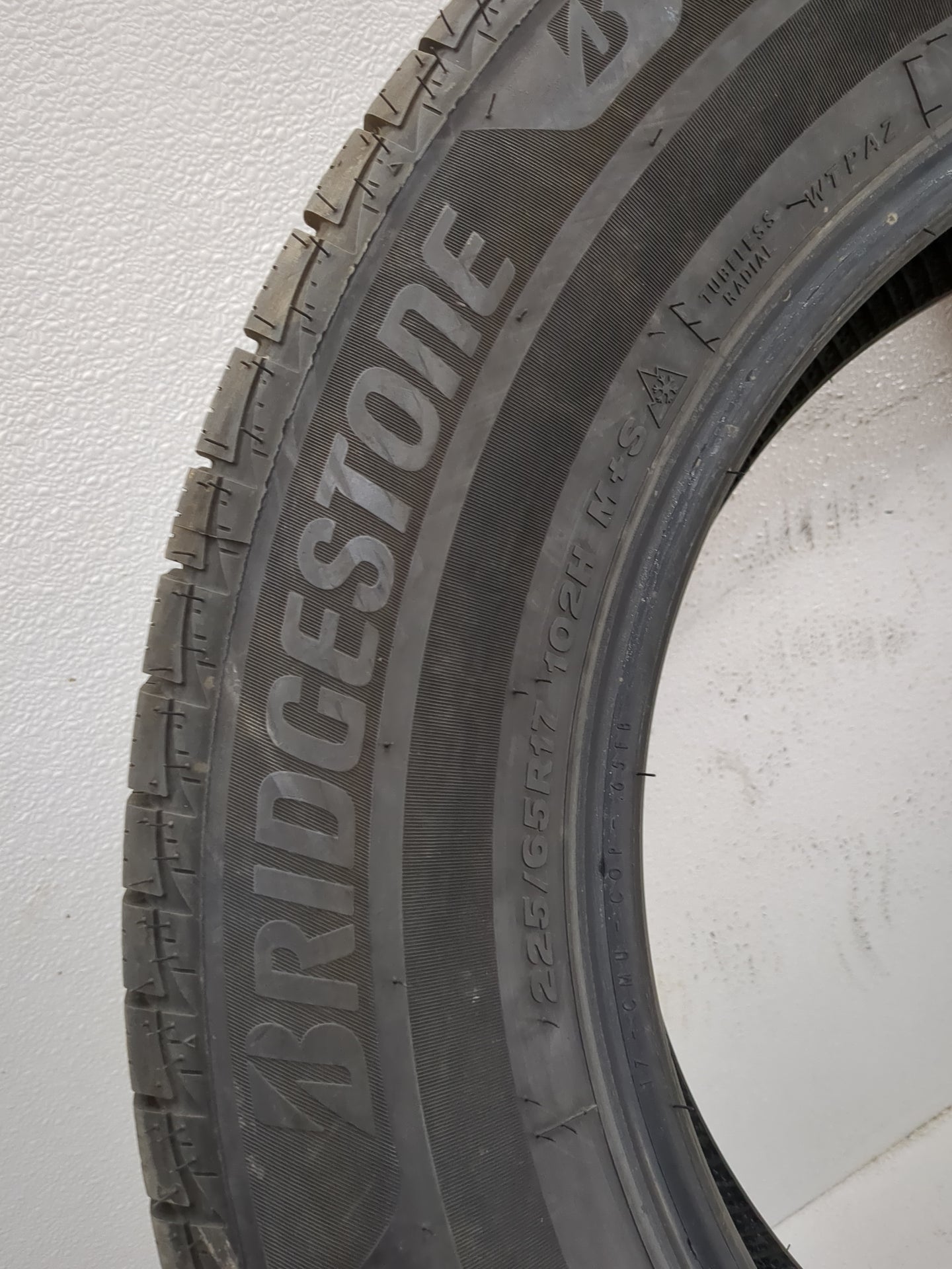 Used Tire 225/65R17 BRIDGESTONE WEATHERPEAK 102H - Tread Depth 10/32 - Oemusedautoparts1.com