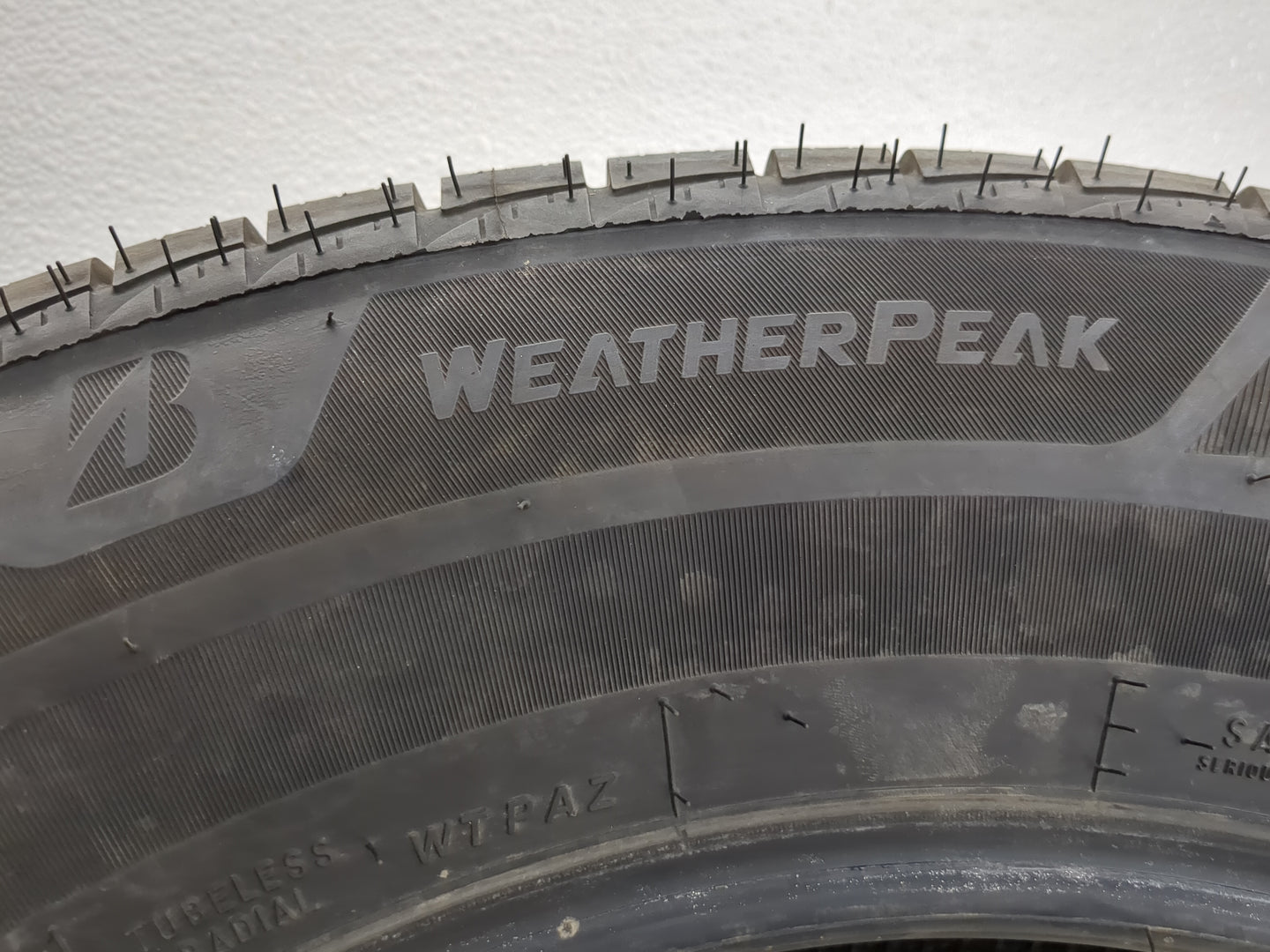 Used Tire 225/65R17 BRIDGESTONE WEATHERPEAK 102H - Tread Depth 10/32 - Oemusedautoparts1.com