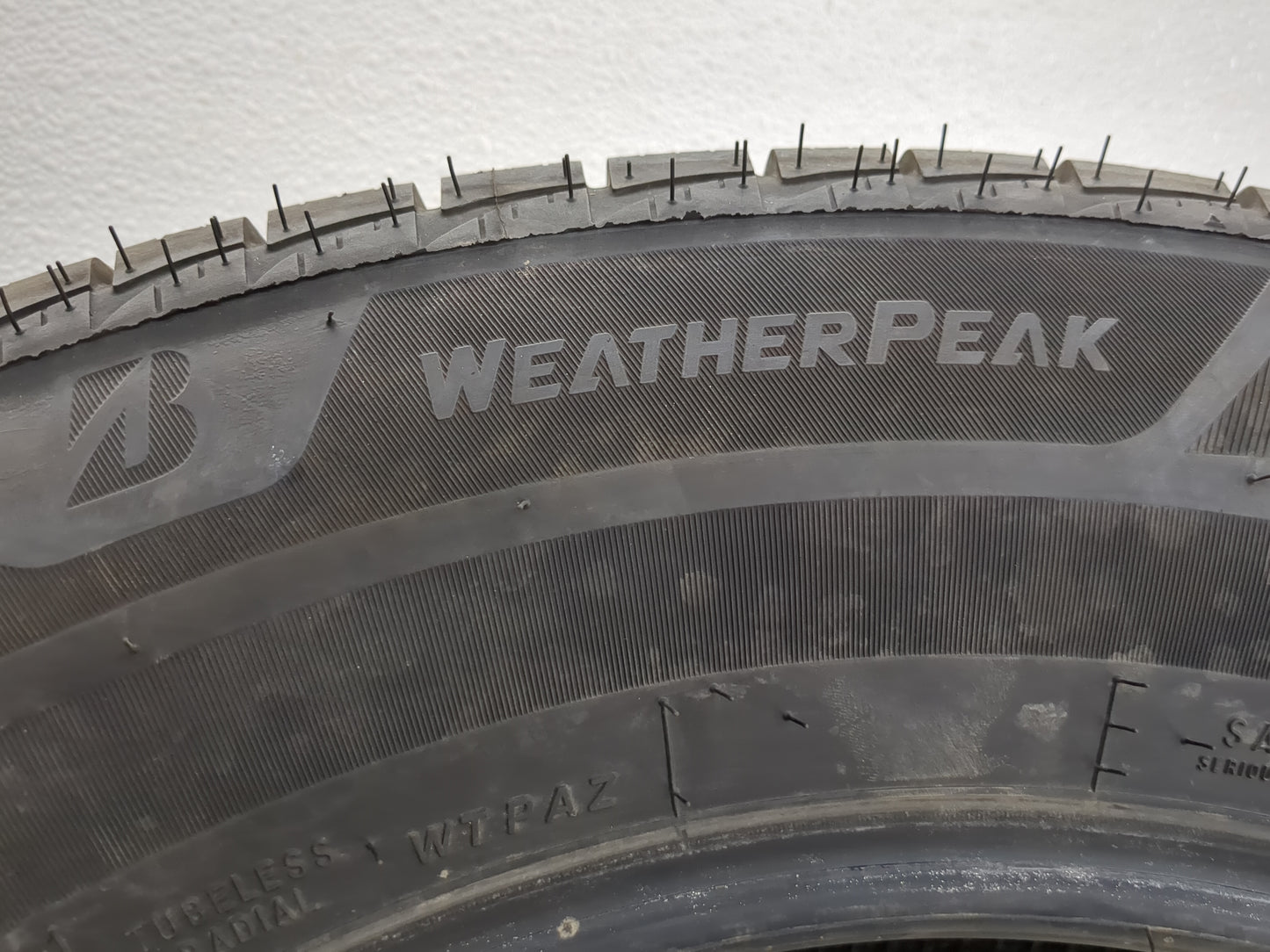 Used Tire 225/65R17 BRIDGESTONE WEATHERPEAK 102H - Tread Depth 10/32 - Oemusedautoparts1.com