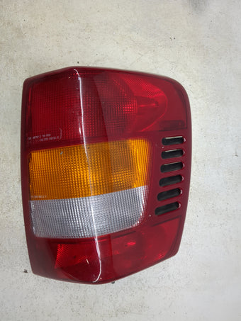 compare product 2002 Jeep Grand Cherokee Tail Light Assembly Passenger Right OEM P/N:333-1925R-AF Fits OEM Used Auto Parts