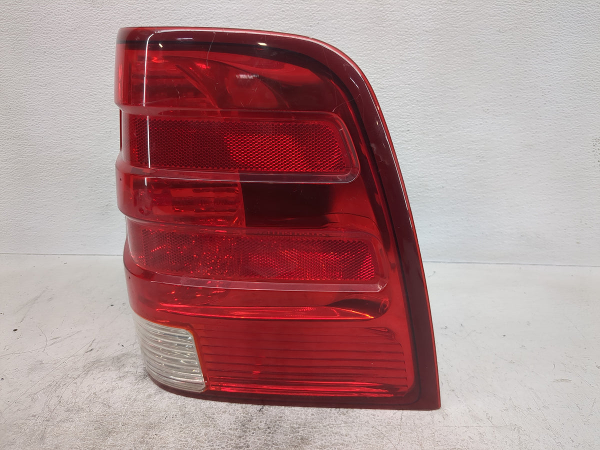 2003-2006 Ford Expedition Tail Light Assembly Driver Left OEM P/N:2L1X-13B504-A Fits Fits 2003 2004 2005 2006 OEM Used Auto 