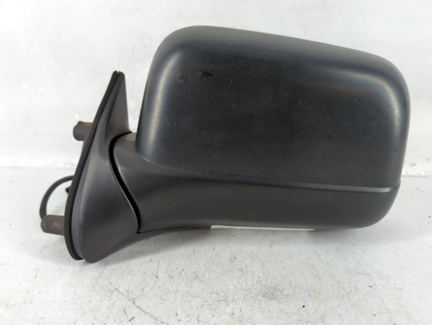 2000-2004 Nissan Frontier Driver Left Side View Manual Door Mirror Black - Oemusedautoparts1.com
