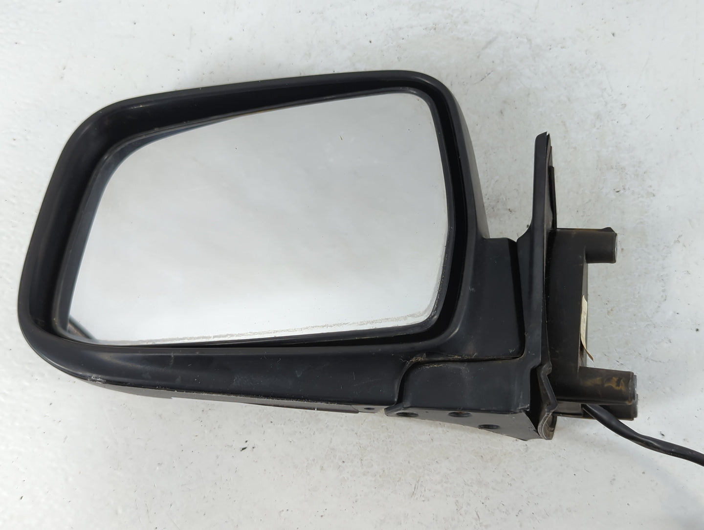 2000-2004 Nissan Frontier Driver Left Side View Manual Door Mirror Black - Oemusedautoparts1.com