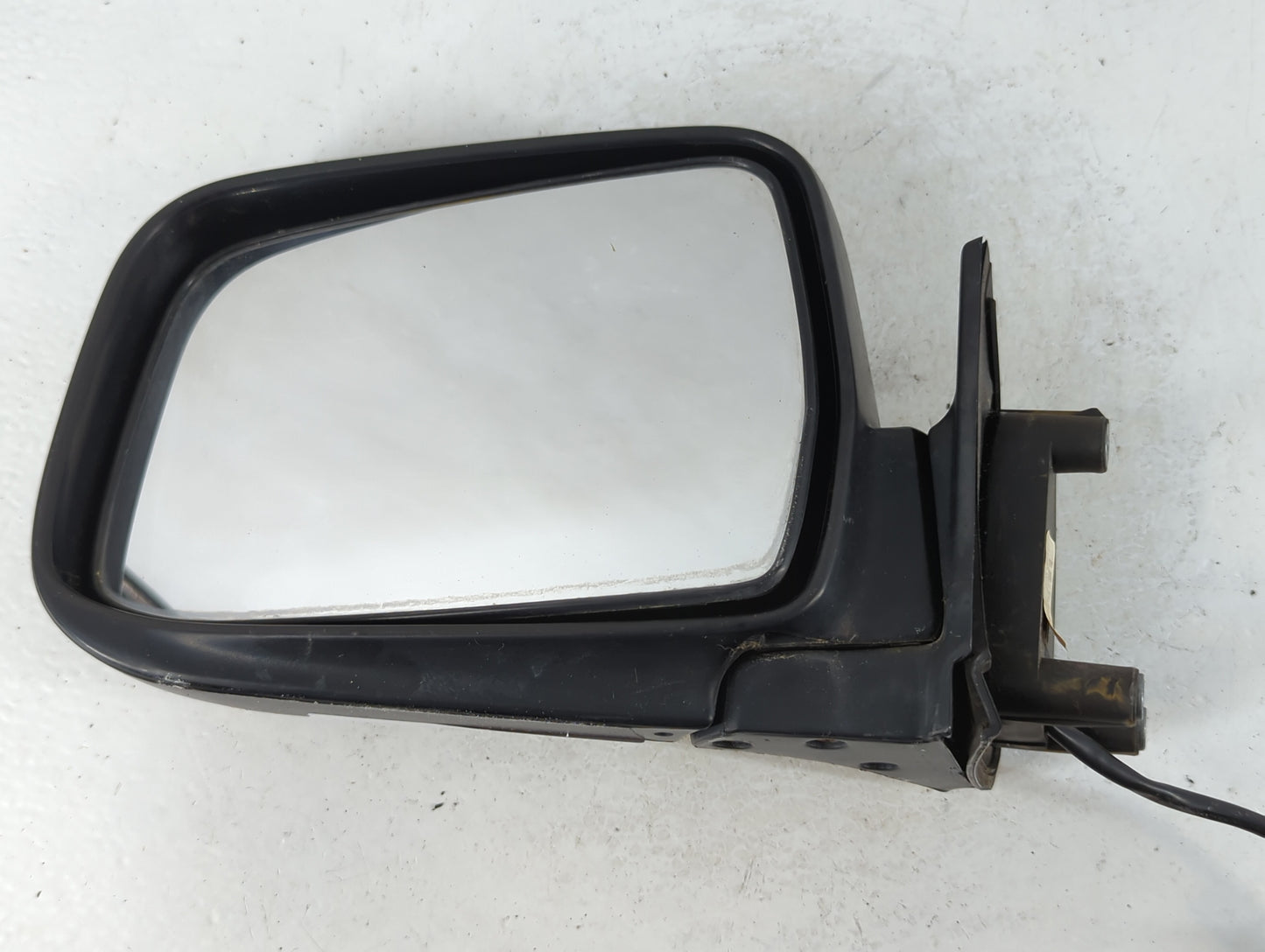 2000-2004 Nissan Frontier Driver Left Side View Manual Door Mirror Black - Oemusedautoparts1.com