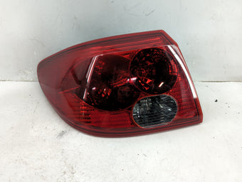 compare product 2005 Saturn L200 Tail Light Assembly Driver Left OEM P/N:22699950 Fits OEM Used Auto Parts