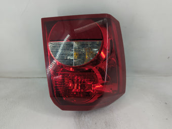 compare product 2006 Dodge Caliber Tail Light Assembly Driver Left OEM P/N:320077 Fits OEM Used Auto Parts