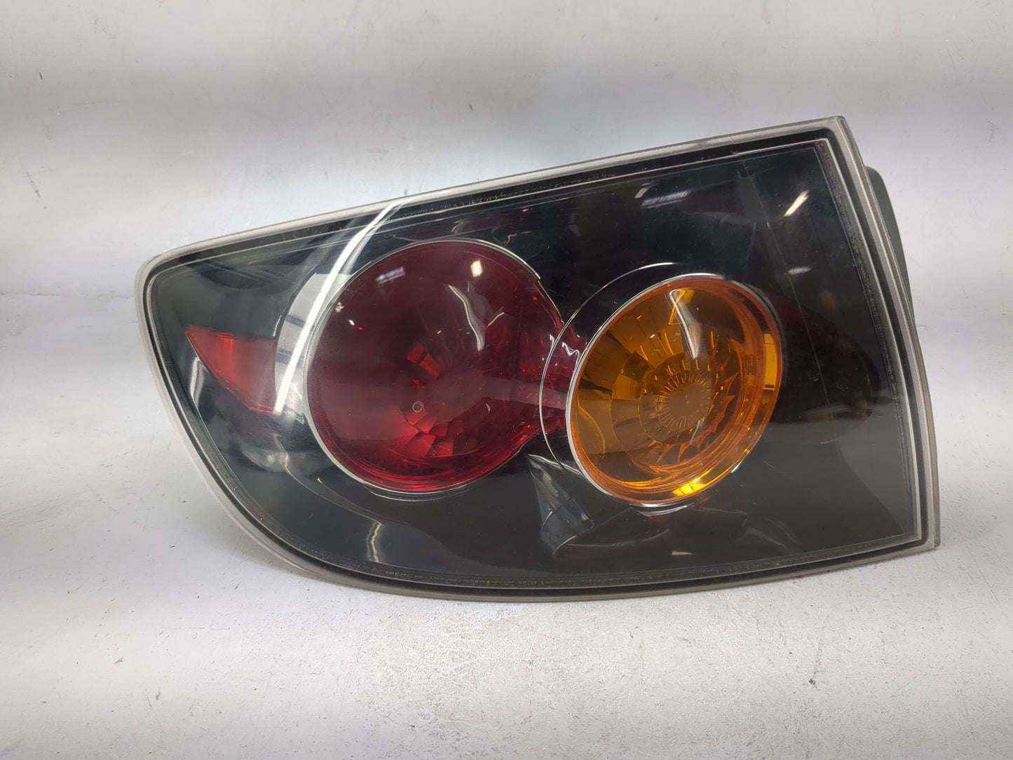 2006 Mazda Mazda3 Tail Light Assembly Driver Left OEM Fits Fits 2004 2005 OEM Used Auto Parts - Oemusedautoparts1.com