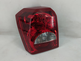 compare product 2007 Dodge Caliber Tail Light Assembly Driver Left OEM P/N:05303753 Fits OEM Used Auto Parts