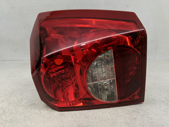 compare product 2007 Dodge Caliber Tail Light Assembly Passenger Right OEM P/N:0530388CA 05303752 A Fits OEM Used Auto Parts