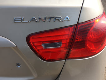 compare product 2007 Hyundai Elantra Passenger Right Side Deck Lid Mounted Tail Light 1216842