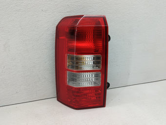 compare product 2007 Jeep Patriot Tail Light Assembly Driver Left OEM P/N:224133 224135, 224131 Fits OEM Used Auto Parts