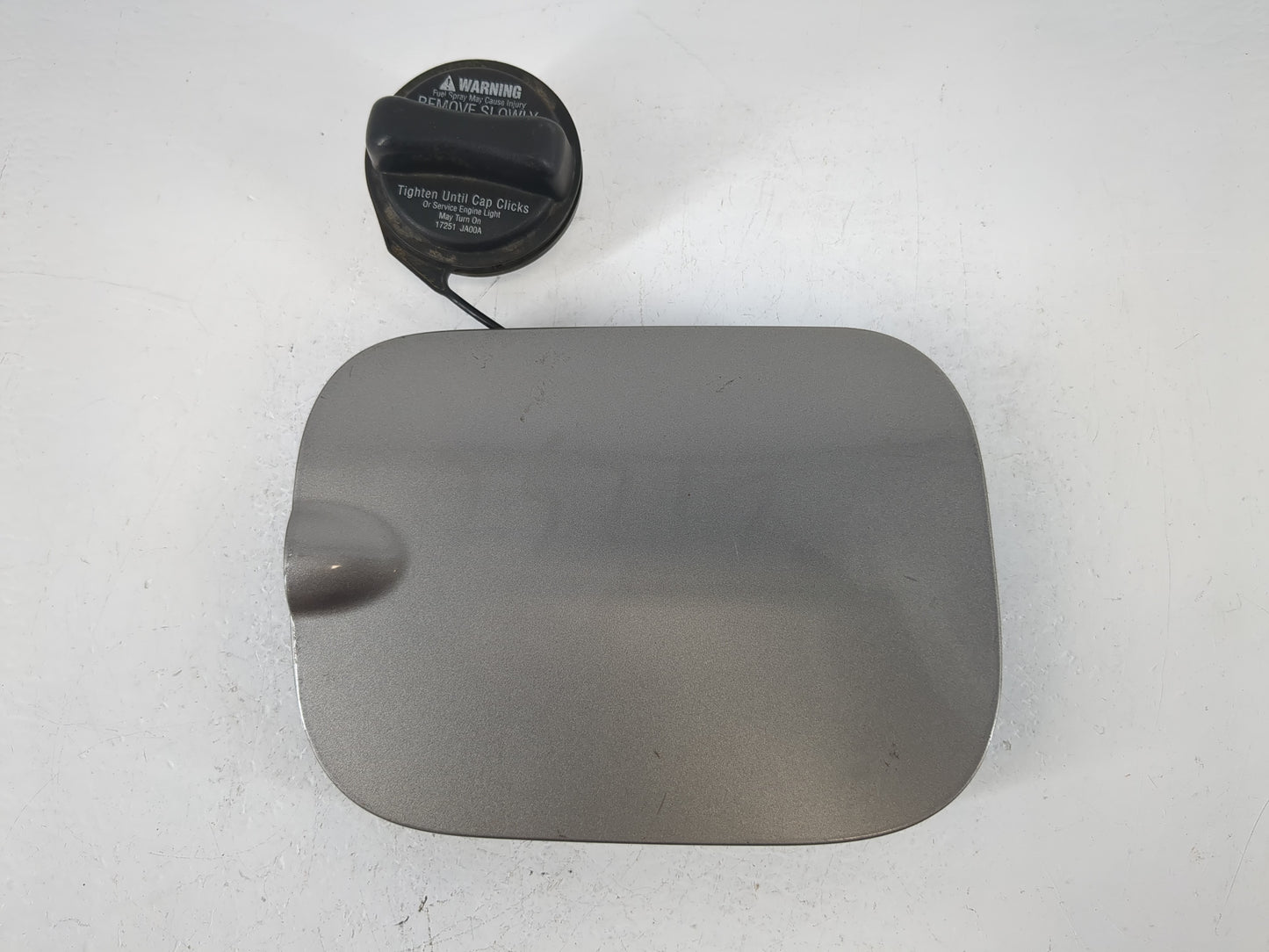 2008 Nissan Rogue Fuel Tank Door Lid Gas Tank Grey - Oemusedautoparts1.com