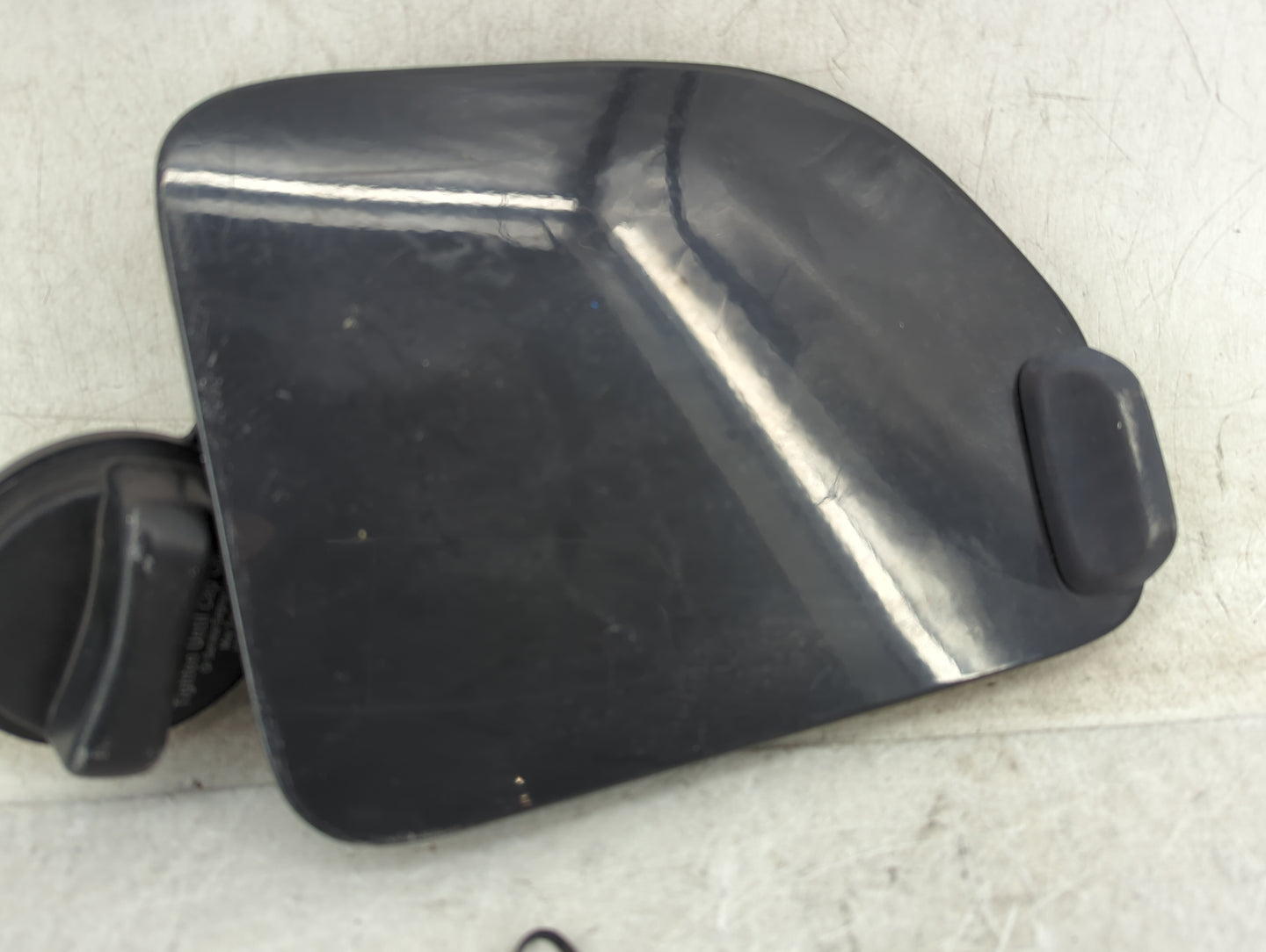 2008 Nissan Xterra Fuel Tank Door Lid Gas Tank Black - Oemusedautoparts1.com