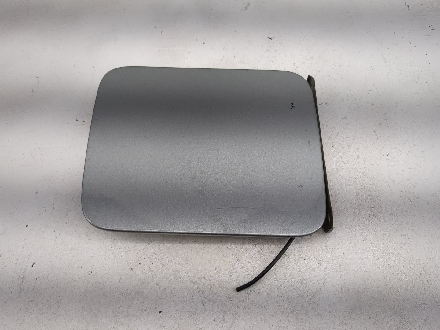 2009 Nissan Sentra Fuel Tank Door Lid Gas Tank Gray - Oemusedautoparts1.com