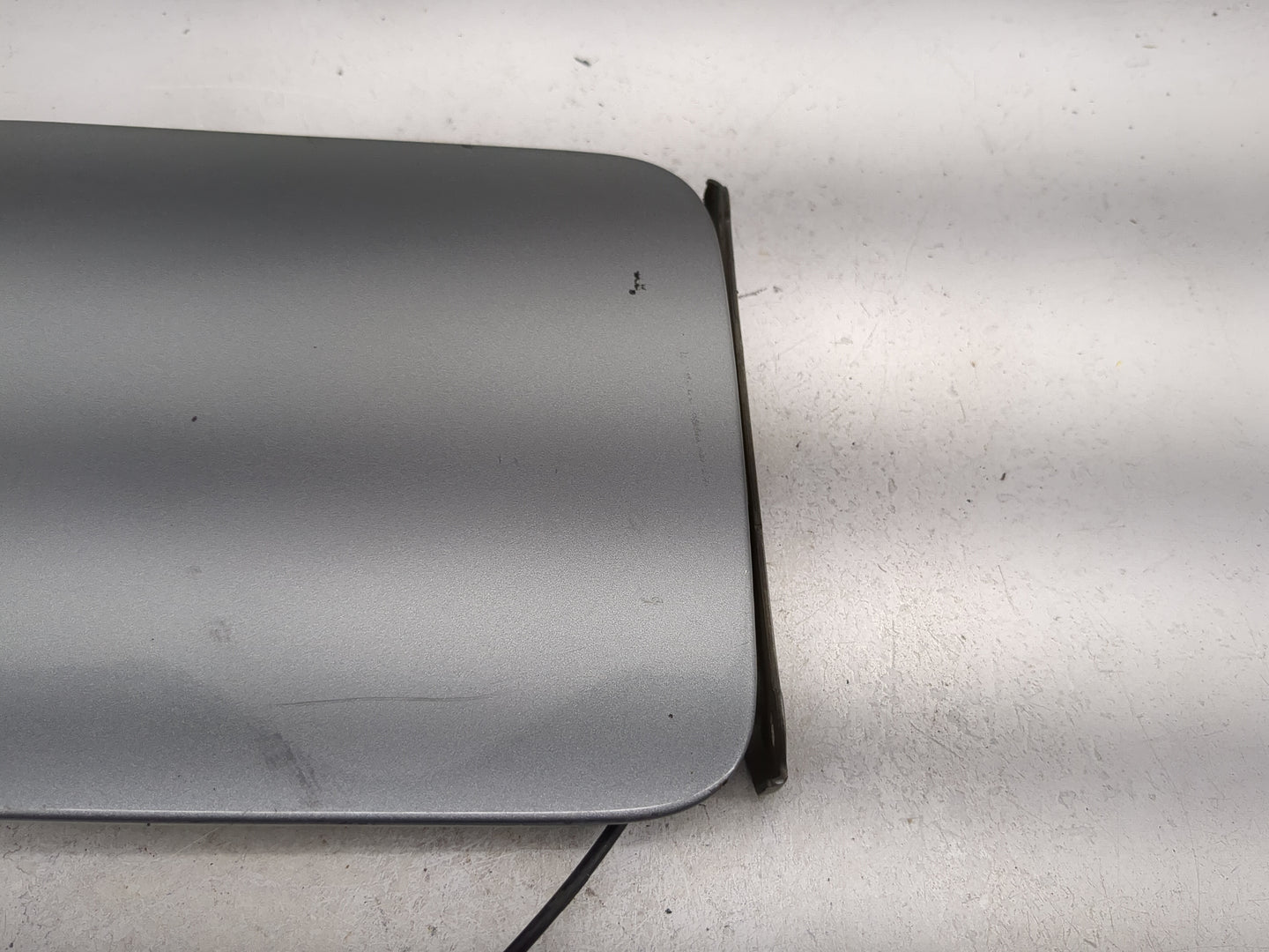 2009 Nissan Sentra Fuel Tank Door Lid Gas Tank Gray - Oemusedautoparts1.com