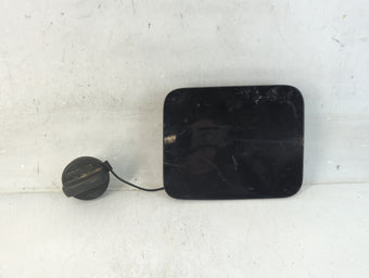 compare product 2012 Nissan Quest Fuel Tank Door Lid Gas Tank Black