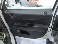 2013 Jeep Patriot Front Right Passenger Interior Door Panel Trim - Oemusedautoparts1.com
