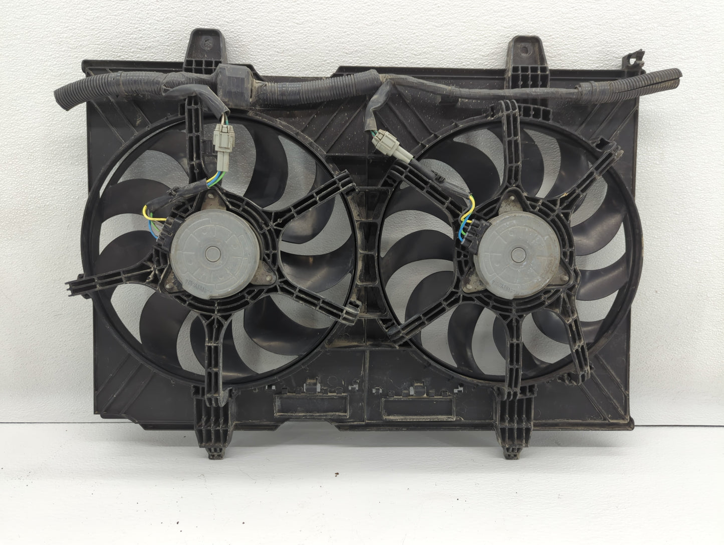 2010-2015 Nissan Rogue Left Radiator Fan Motor Assembly - Oemusedautoparts1.com