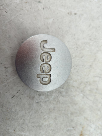 compare product 2014 Jeep Wrangler Center Cap Oem Silver 1517206