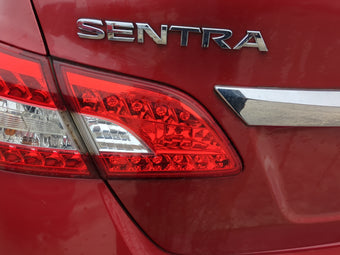 compare product 2013 Nissan Sentra Driver Left Side Tail Light Taillight Deck Lid Mounted