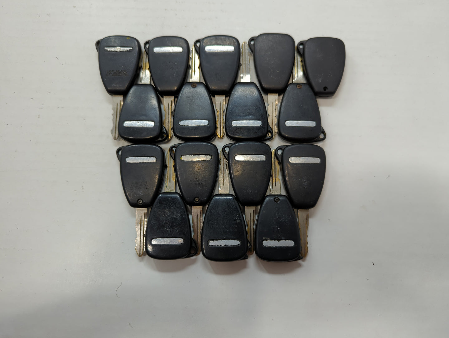 Lot of 16 Dodge Keyless Entry Remote Fob MIXED FCC IDS MIXED PART NUMBERS - Oemusedautoparts1.com