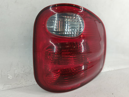 2000-2004 Ford F-150 Tail Light Assembly Passenger Right OEM P/N:44ZH-1499A YL3X-13440-A Fits Fits 2000 2001 2002 2003 2004 OEM Used Auto Parts