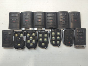 compare product Lot of 13 Cadillac Keyless Entry Remote Fob MIXED FCC IDS MIXED PART