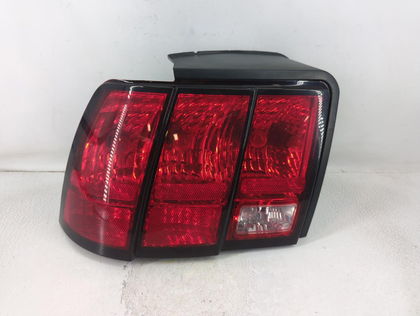 1999-2004 Ford Mustang Tail Light Assembly Driver Left OEM P/N:13411-AA 02299051D Fits Fits 1999 2000 2001 2002 2003 2004 OEM Used Auto Parts - Oemusedautoparts1.com