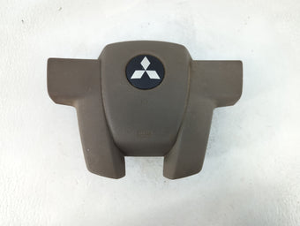 compare product 2011 Mitsubishi Endeavor Air Bag Driver Left Steering Wheel Mounted Fits OEM Used Auto Parts