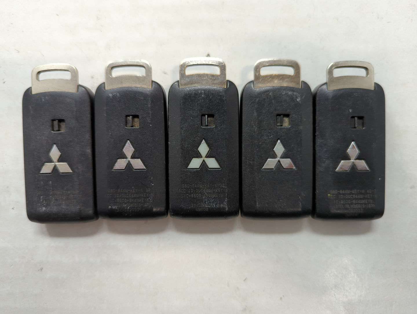 Lot of 5 Mitsubishi Keyless Entry Remote Fob MIXED FCC IDS MIXED PART - Oemusedautoparts1.com