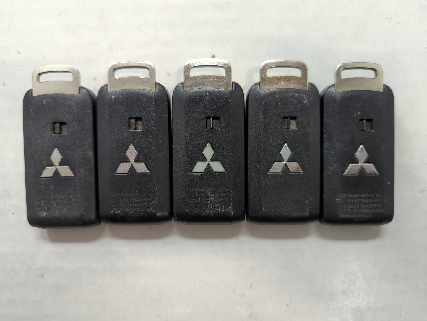 Lot of 5 Mitsubishi Keyless Entry Remote Fob MIXED FCC IDS MIXED PART - Oemusedautoparts1.com