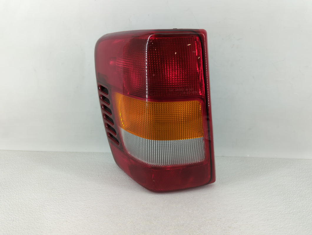 2003-2004 Jeep Grand Cherokee Tail Light Assembly Driver Left OEM Fits 2003 2004 OEM Used Auto Parts